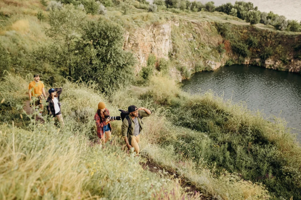 53766834037_9670eb91f7_o 1 - Business Connect Adventure A group of healthy hikers approaching a lake deep in the mountains[
